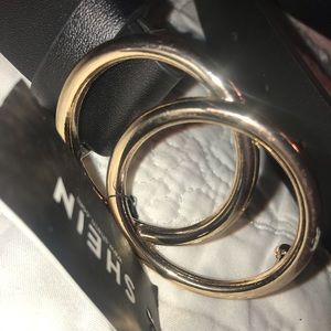 Black belt with gold buckle